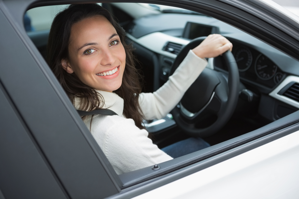 woman driving smiling